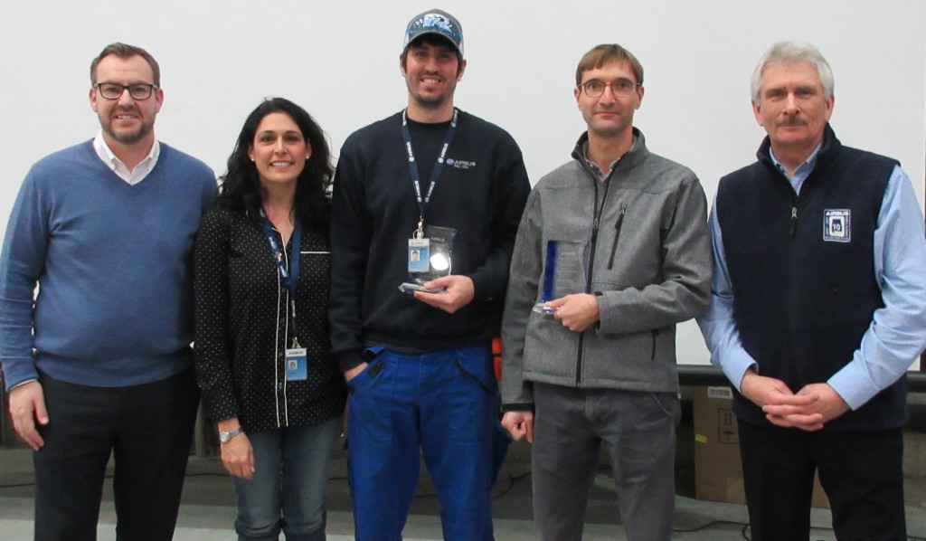  Daryl Taylor (far left), Stephanie Burt (2nd from left) and Barry Eccleston (far right) presented two Peer Awards earlier this month to Michael Prestwood (center) and Vincent Seurot.